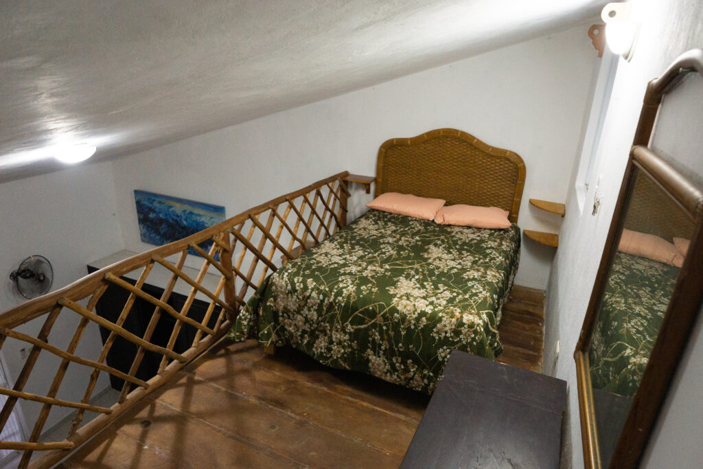 Unique wooden mezzanine bedroom with private access to 3rd floor rooftop solarium - Casa Chentuk.